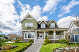 a beautiful two-story home with a paved walkway on Beech Mountain