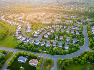a beautiful neighborhood in Banner Elk pictured from above as morning light shines on it